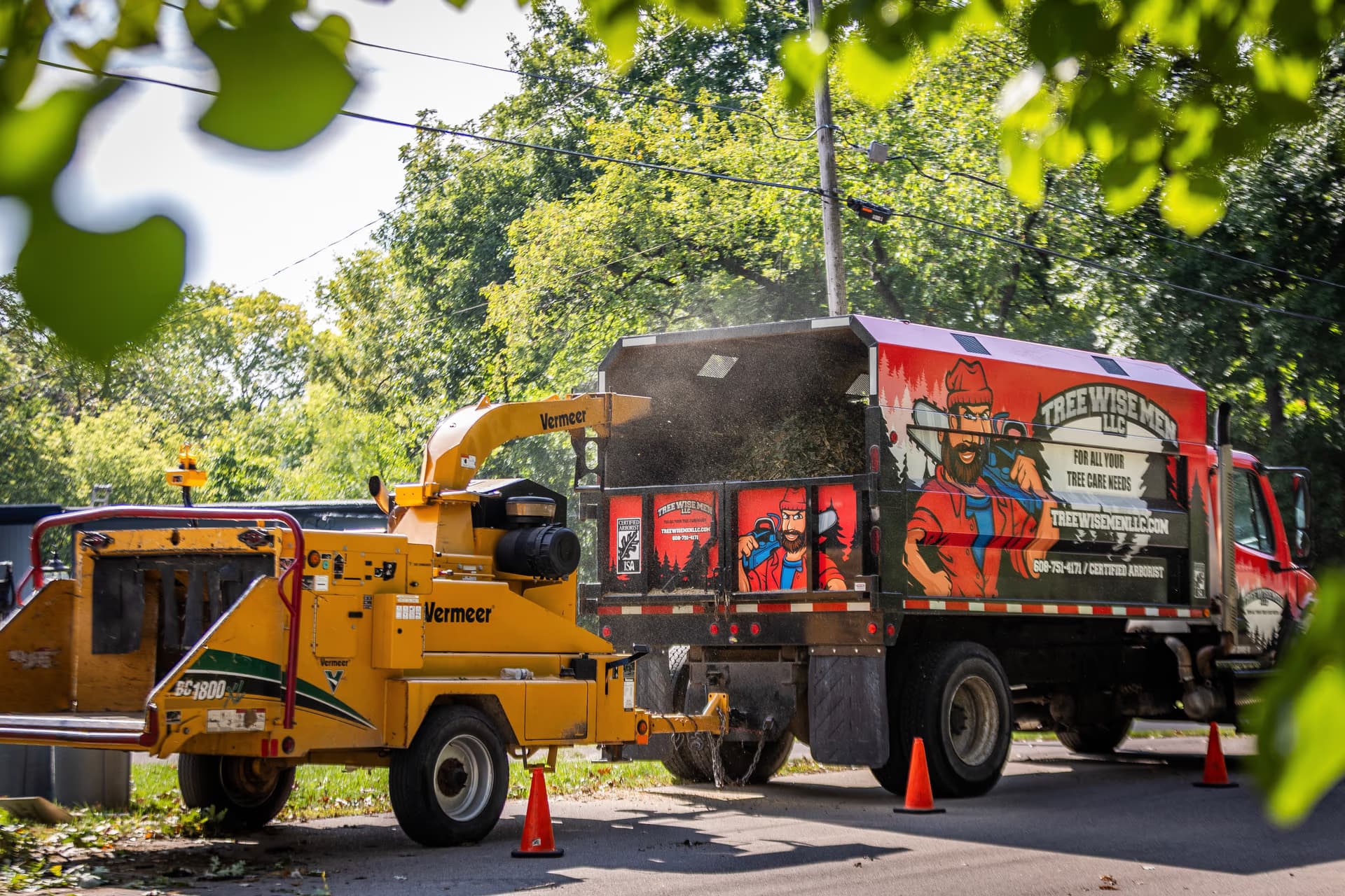 Chipper and branded truck working a multi-property route