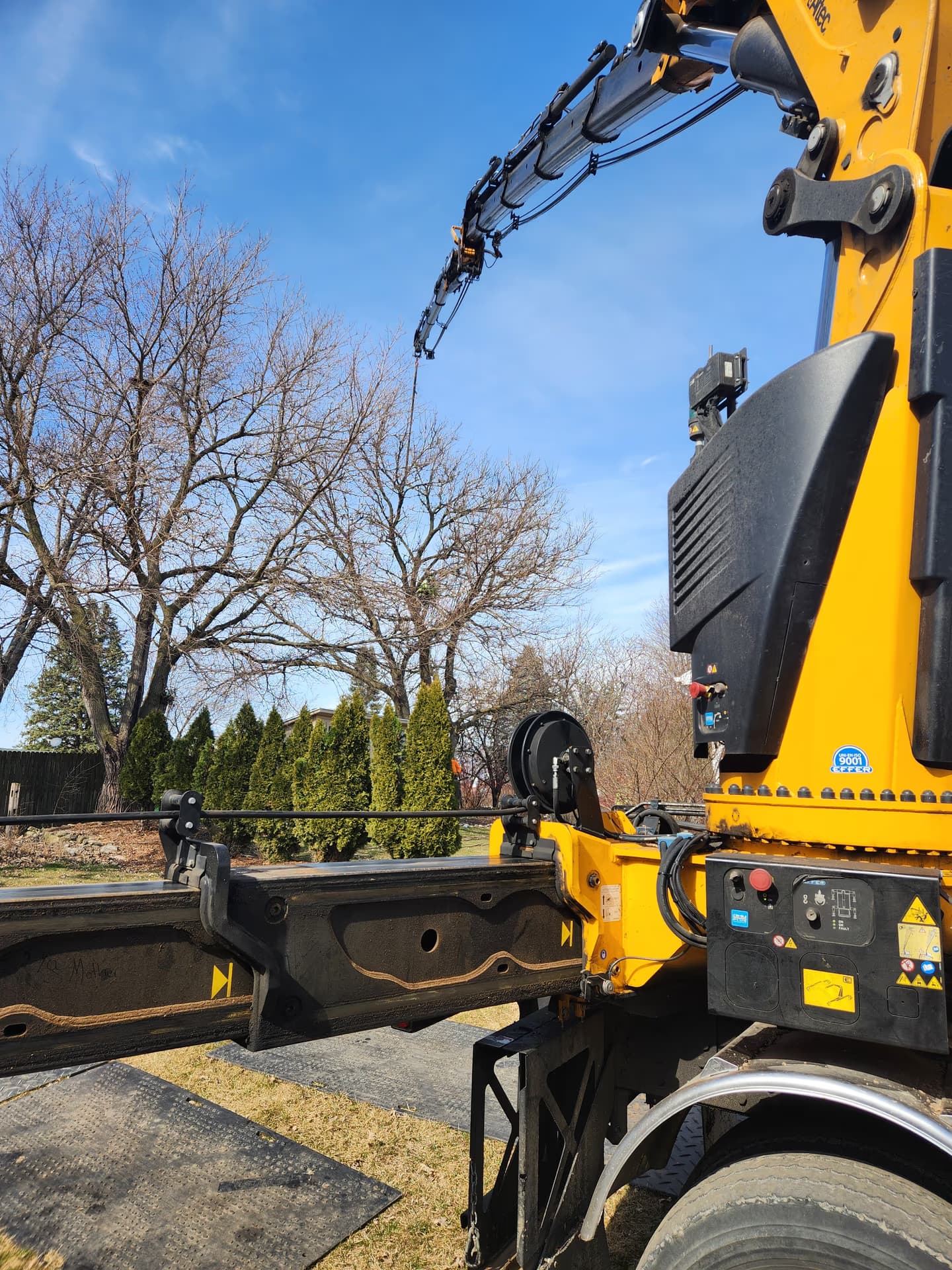 Grapple saw truck set up for a residential tree removal in Jefferson County, Wisconsin