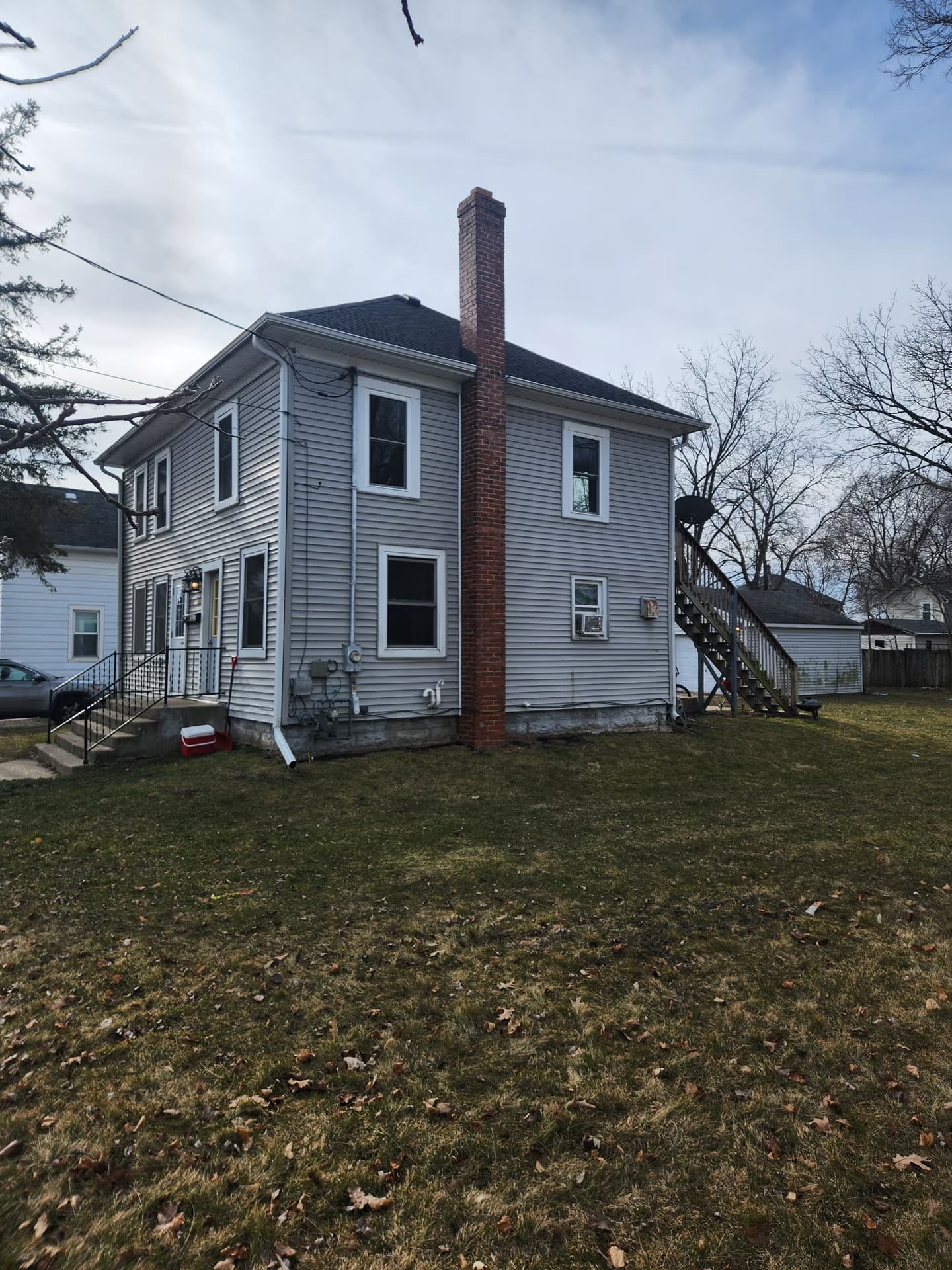 ISA Certified Arborist assessing trees on a Janesville, Wisconsin property