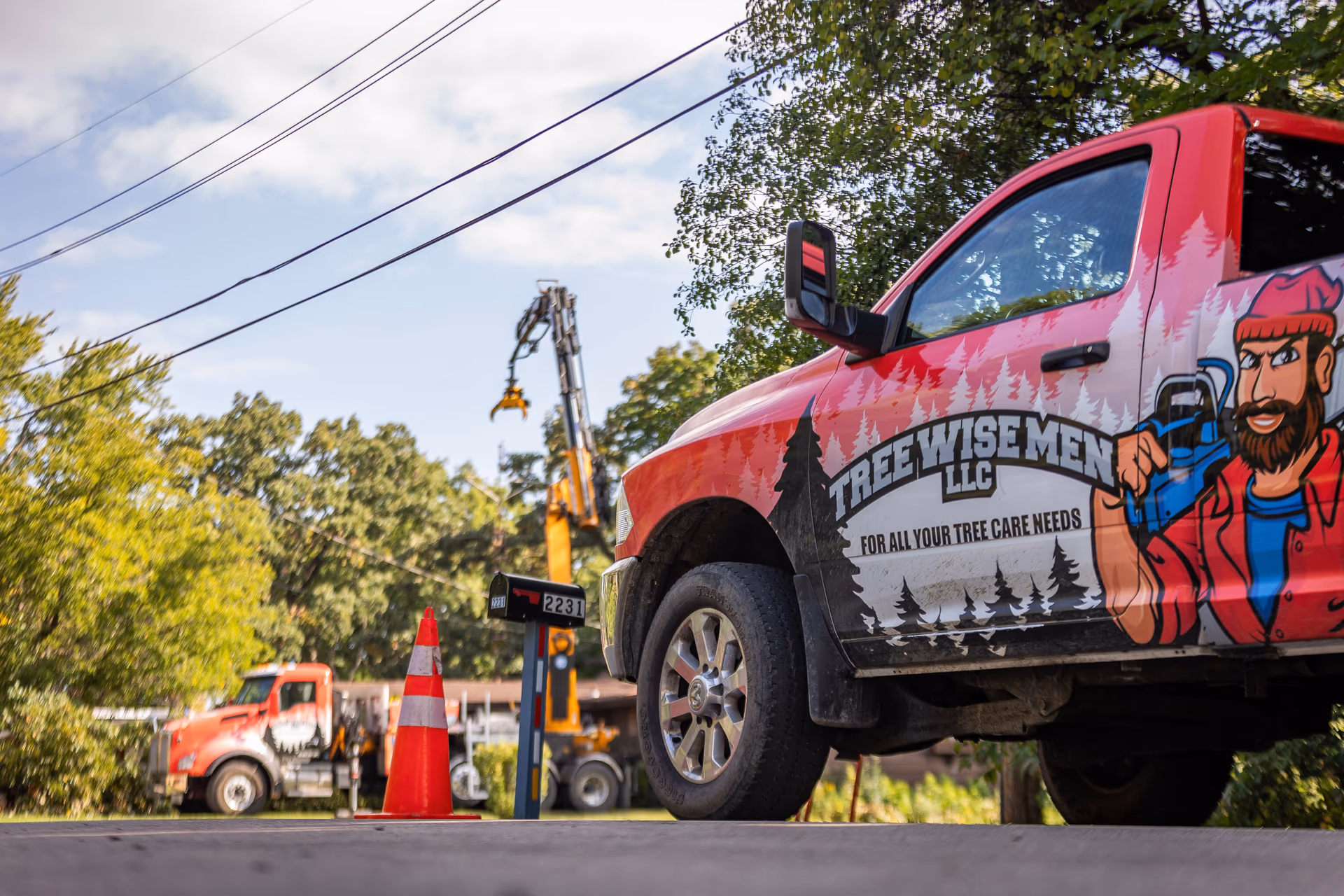 Tree Wise Men branded pickup truck on a Southern Wisconsin job site