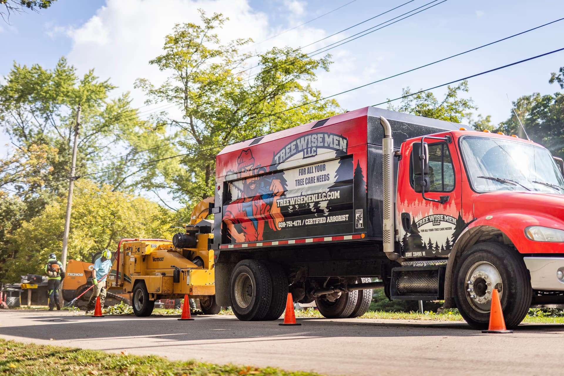 Tree Wise Men branded truck and crew on a job site in Southern Wisconsin